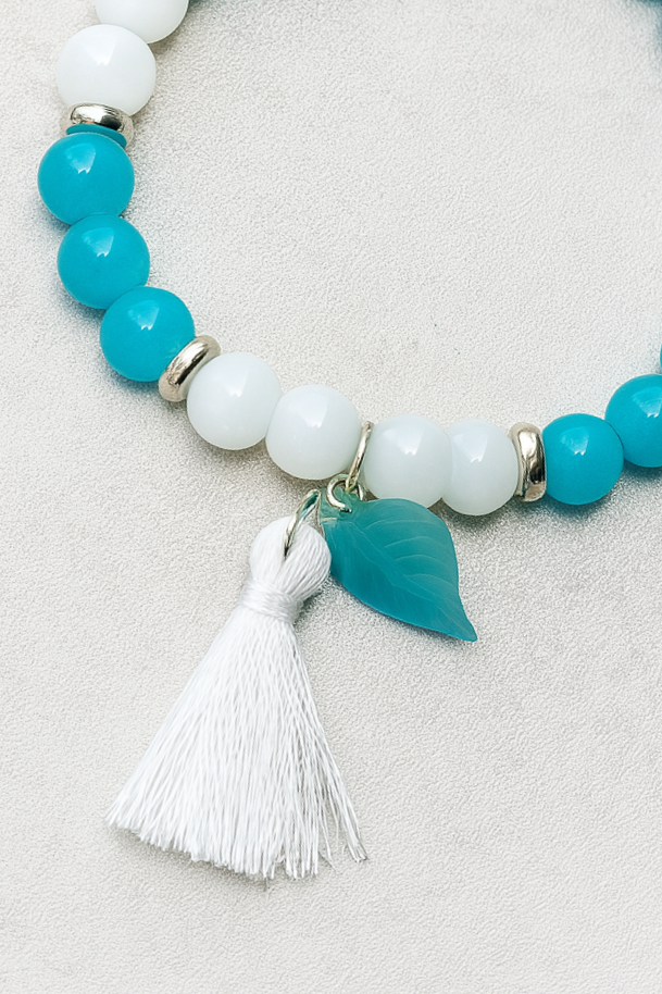 Blue & White Beaded Stretch Bracelet with Tassel and Leaf Charm